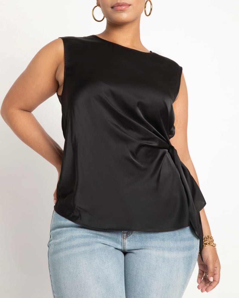 Front of a model wearing a size 14 Aria Tie Side Satin Tank in Totally Black by ELOQUII. | dia_product_style_image_id:206677